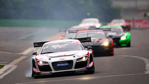 Captivating Car Racing In Action Wallpaper