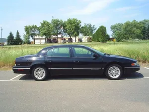 Captivating Chrysler Lhs In Action Wallpaper