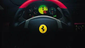 Captivating Control: An Up-close View Of A Car's Steering Wheel Wallpaper