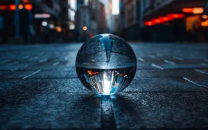 Captivating Crystal Ball With Magical Visions Wallpaper