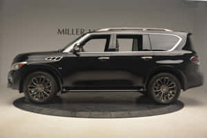 Captivating Infiniti Qx80 Luxury Suv On The Road Wallpaper