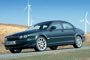 Captivating Jaguar X-type In Action Wallpaper