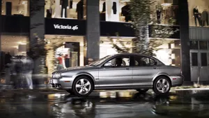 Captivating Jaguar X-type Luxury Sedan In Motion Wallpaper