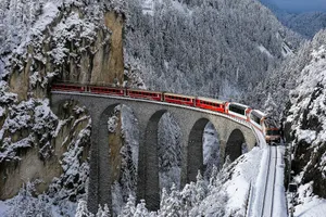 Captivating Journey With The Glacier Express In The Magnificent Swiss Alps Wallpaper