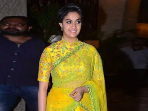 Captivating Keerthi Suresh In A Stunning Yellow Dress Wallpaper