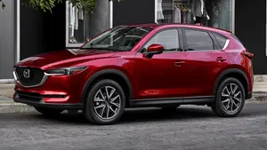 Captivating Mazda Cx-5 In A Vibrant Cityscape Wallpaper
