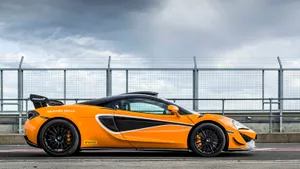Captivating Mclaren 620r In Motion Wallpaper