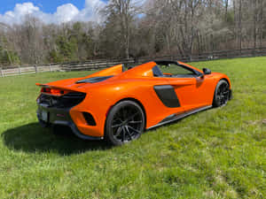 Captivating Mclaren 675lt Spider In Action Wallpaper