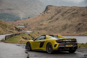 Captivating Mclaren 675lt Spider In Action Wallpaper