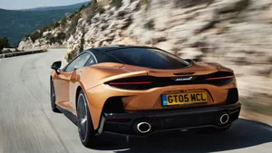 Captivating Mclaren Gt In Action Wallpaper
