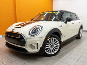 Captivating Mini Cooper S Clubman All4 In Motion Wallpaper