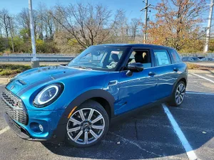 Captivating Mini Cooper S Clubman All4 On The Move Wallpaper