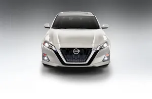 Captivating Nissan Altima On A Scenic Road Wallpaper