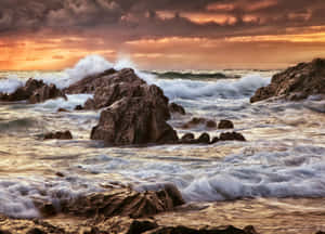 Captivating Ocean Tides At Sunset Wallpaper