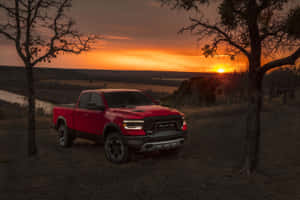 Captivating Power: The Impressive Dodge Ram On A Mountainous Road Wallpaper