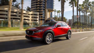 Captivating Red Mazda Cx-30 In Action Wallpaper