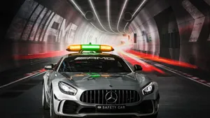 Captivating Safety Car On The Racetrack Wallpaper