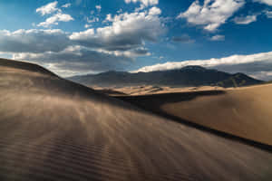 Captivating Sand Dunes At Sunset Wallpaper