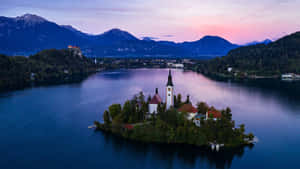 Captivating View Of Lake Bled Church, Slovenia Wallpaper