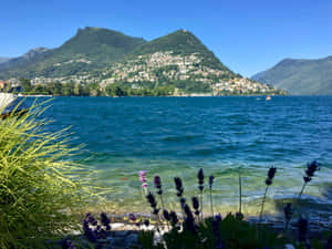 Captivating View Of Lugano Lake In Switzerland Wallpaper