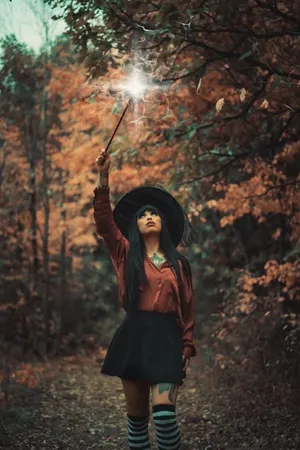 Captivating Witch Costume In Enchanting Forest Wallpaper