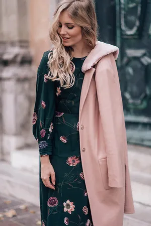 Captivating Woman In Pink Coat Wallpaper