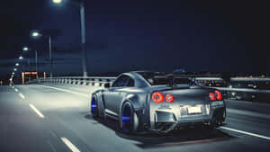 Capture The Speed And Design Of The Cool Nissan Skyline Wallpaper