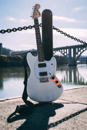 Capturing A Moment Of Reflection With This Enchanting Guitar Wallpaper