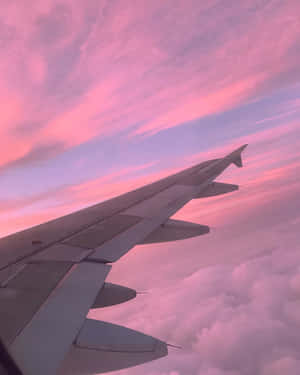 Capturing Dreams With A Pink Plane Wallpaper