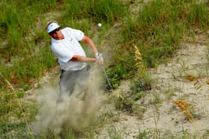 Carl Pettersson Swinging His Golf Club On The Course Wallpaper