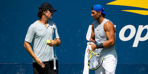 Carlos Moya And Nadal Chatting Wallpaper