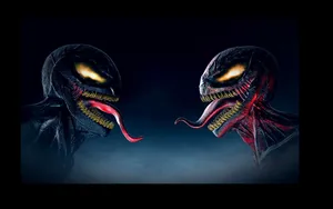 Carnage And Venom Face Off In Epic Battle Wallpaper