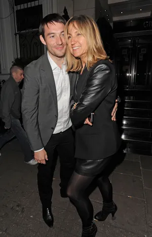 Carol Mc Giffin Smiling With Companion Wallpaper