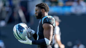 Carolina Panthers Player Holding Helmet Wallpaper