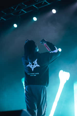 Carti Pfp With Blue Stage Lights Wallpaper