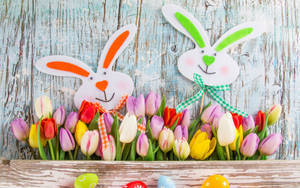 Cartoon Bunnies Happy Easter With Tulips Wallpaper