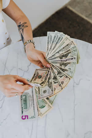 Cash_ Fan_ Held_in_ Hand_ Money_ Aesthetic.jpg Wallpaper