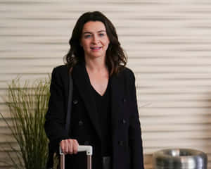 Caterina Scorsone Smiling With Luggage Wallpaper