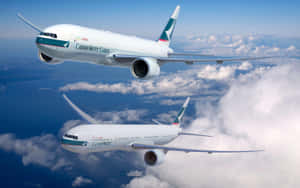 Cathay Pacific Boeing Aircraftsin Flight Wallpaper