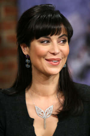 Catherine Bell Smilingwith Elegant Necklace Wallpaper