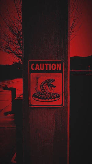 Caution Under Dark Red Sky Wallpaper