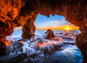 Cave_ View_4 K_ Sunrise_ Sea_ Waves.jpg Wallpaper