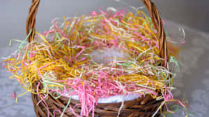 Celebrate Easter With A Colorful Basket Full Of Treats. Wallpaper