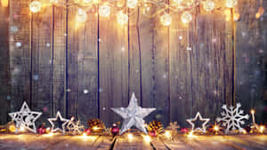 Celebrate The Holiday Season With A Twinkling Christmas Star Wallpaper