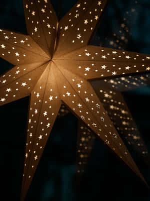 Celebrate The Holidays With A Glowing Christmas Star Wallpaper