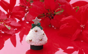 Celebrate The Holidays With This White Christmas Tree And Its Charming Decorations Wallpaper