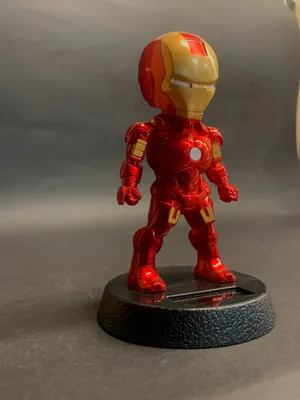 Celebrate The Iron Man With Stylized Bobbleheads. Wallpaper