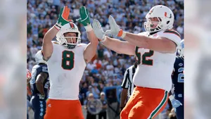 Celebratory Football Players High Five Wallpaper