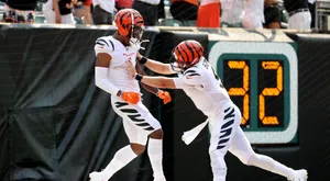 Celebratory Football Players High Five Wallpaper