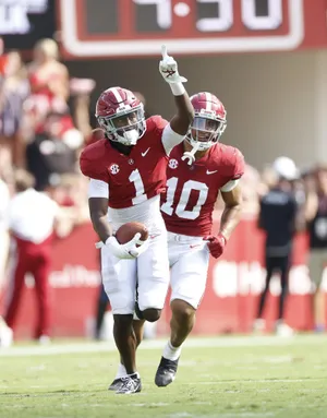 Celebratory Football Players Number1and10 Wallpaper